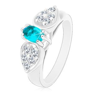 Lesklý prsten ve stříbrném odstínu, blýskavá mašlička s modrým oválem - Velikost: 57